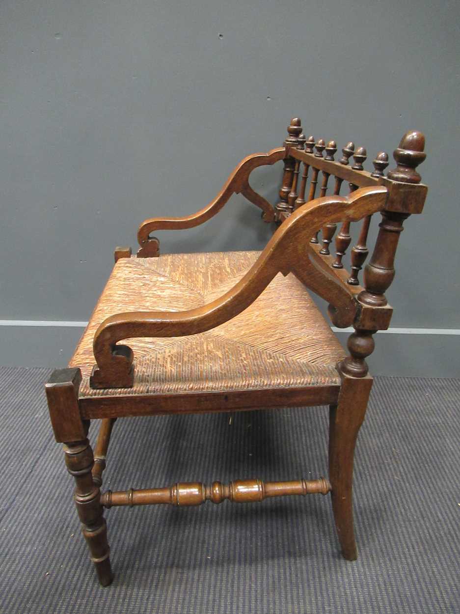 A 19th century rush seated hall chair, with down swept armsThe wood is stained beech. - Image 2 of 5