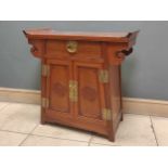 A Chinese hardwood side cabinet, fitted with a single drawer above a pair of cupboard doors, 74 x 74