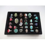Three ring trays, one with 32 assorted gemstone rings, together with a quantity of silver