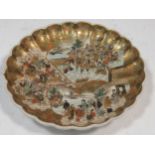 A satsuma dish, 19.5cm diameterFading to the gilt and decoration with some markings/stainings to the