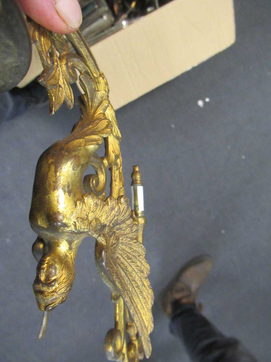 A pair of 19th century gilt metal wall sconces together with a brass candlestick with dolphin - Image 4 of 5