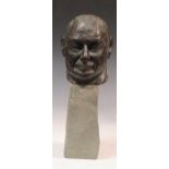 A cast bronze bust of a gentleman on a stone plinth, head 13cm high