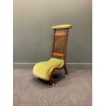 A Victorian prie dieu chair of typical formDamage to the legs with some repair. Some damage to the