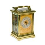 A French lacquered brass repeating carriage clock, early 20th century, the gong striking movement