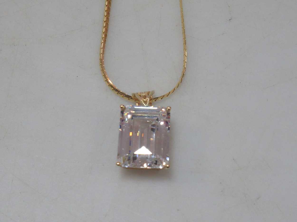 A cubic zirconia pendant hallmarked 14ct gold, suspended from a hallmarked 18ct gold chain, gross - Image 3 of 4