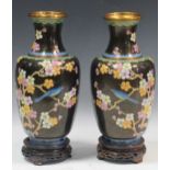 A pair of 20th century Japanese cloisonné vases on stands, 35cm including stands