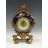 A late Victorian moon shaped mantel clock with gilt metal mounts and replacement movement, 37cm