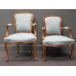 A near pair of Louis XV style carved beech wood fauteuils; together with a pair of 1950s iron framed