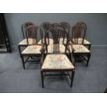 A set of eight Hepplewhite style mahogany dining chairs, including two carvers