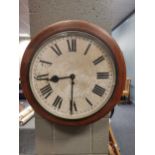 A mid 20th century circular case wall clock made by F. W Elliot ltd