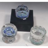 A group of three Whitefriars faceted millefiori paperweights, to include a spoke weight with all-