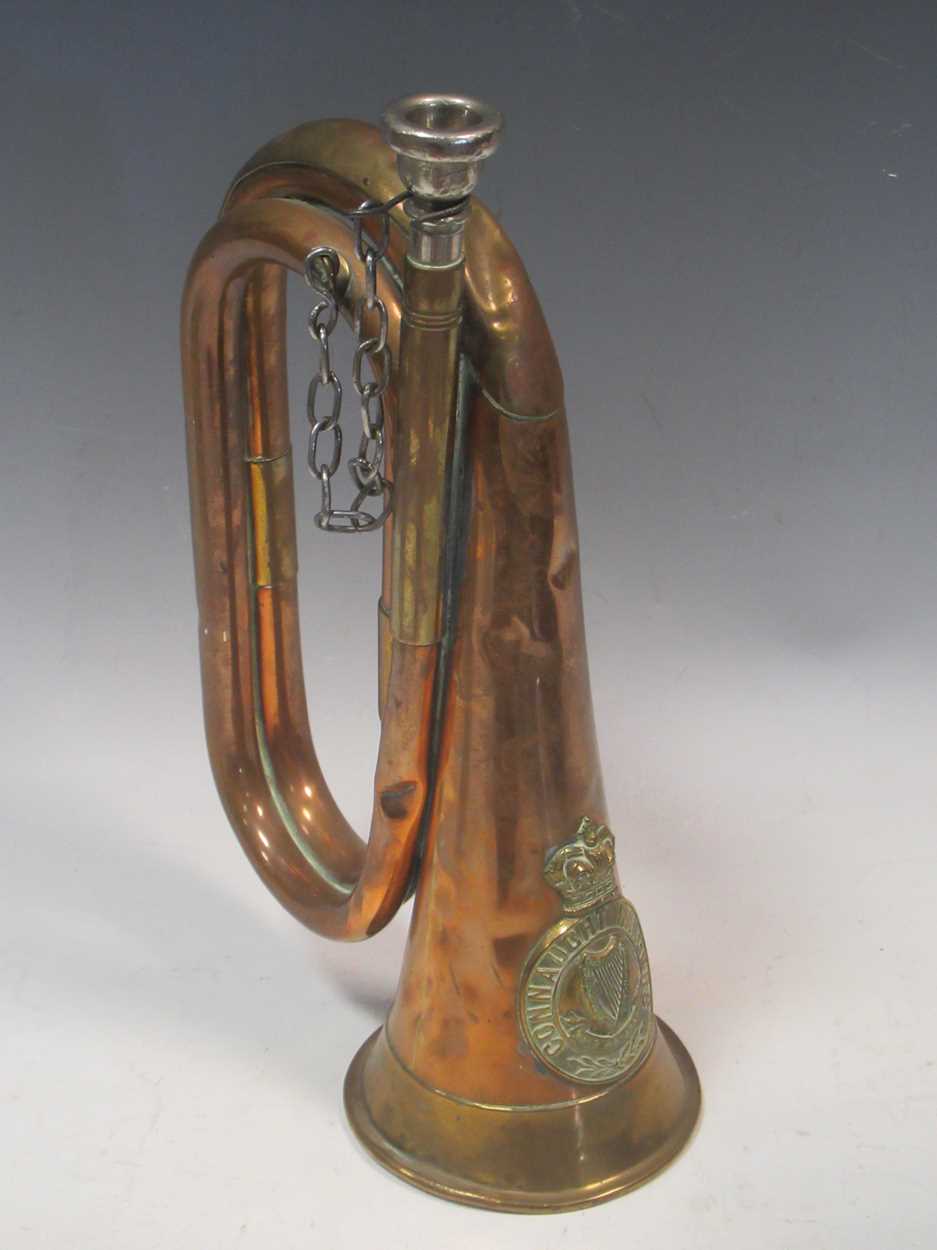 A Connaught Rangers crested copper bugle, stamped 'Potters Aldershot' and marked 'Littlehampton