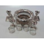 A collection of silverware including a pair of casters, 4 napkin rings and a pair of dwarf