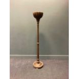 A 20th century walnut standard lamp, with bowl shaped top above a turned column support, 167.5cm