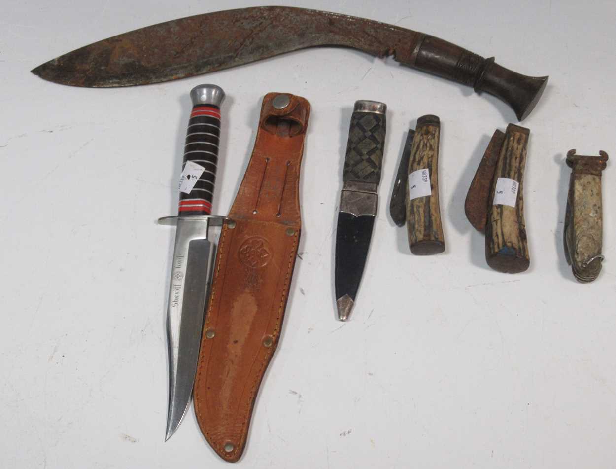 A small skean d'hu, a khukri knife, a hunting knife 'Sheriff, Brazil', and three other folding