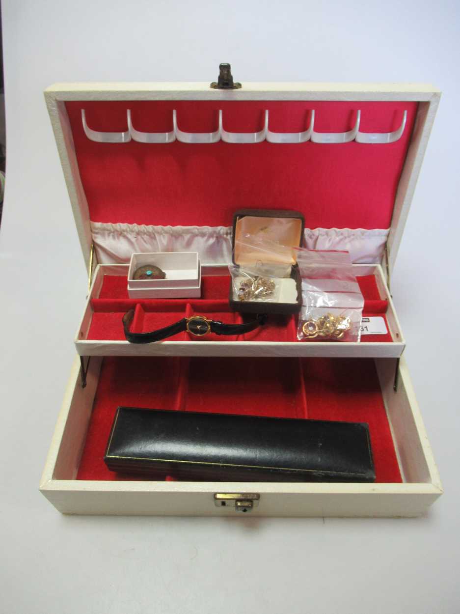 A jewellery box containing, four pairs of earrings and two single earrings tested to at least 18ct
