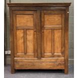 A 17th/ 18th century elm and oak cupboard, the top frieze carved with initials 'EPEH' and bearing