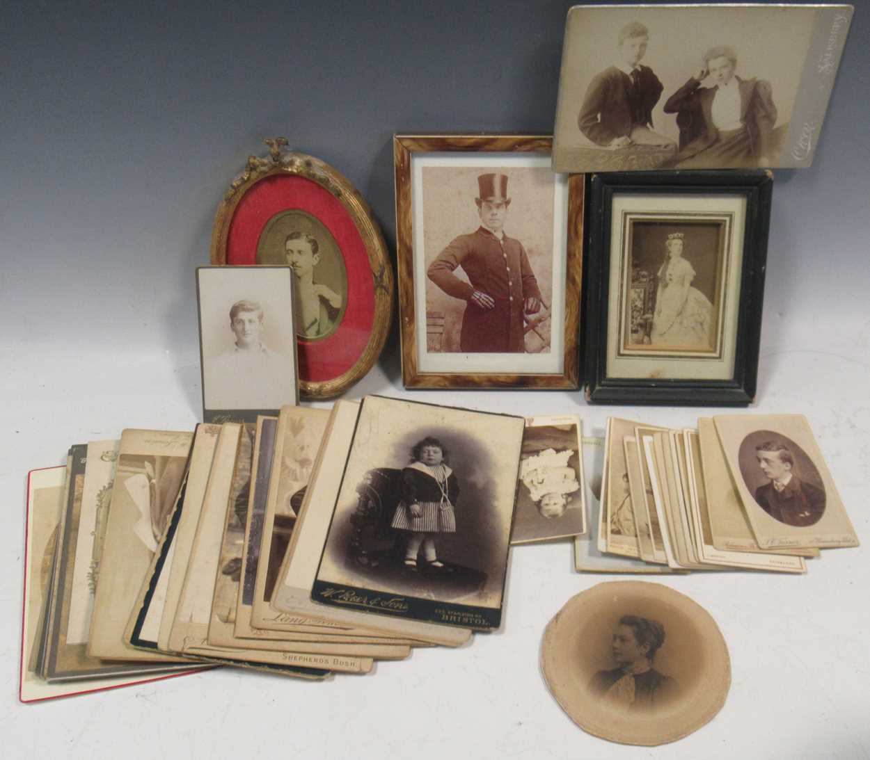 A collection of a quantity of 19th century carte-de-visite, and cabinet cards and small framed