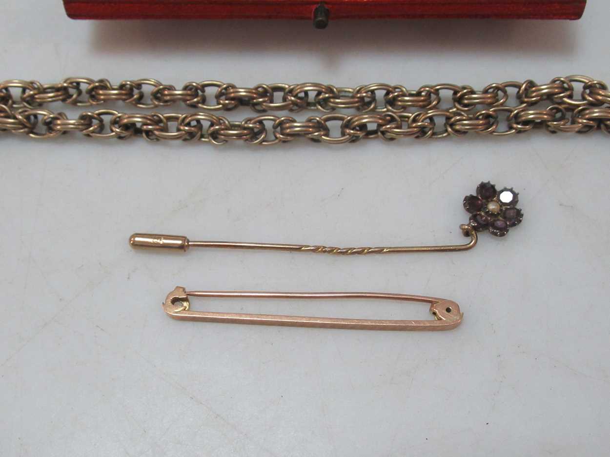 A watch chain tested as 9ct gold, a floral pin tested as '9CT', a brooch stamped '9CT GOLD', gross - Image 2 of 2