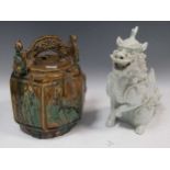 A Chinese pottery water pot 23cm high and a model of a dragon 26cm high (2)
