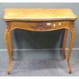 A Louis XV style floral carved serpentine card table on cabriole legs, 73 x 83 x 42cm (closed), 70 x