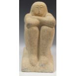 A 20th century carved stone female figure seated with arms crossed, 43 x 21 x 30cm