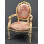 A Louis XVI style painted open armchair