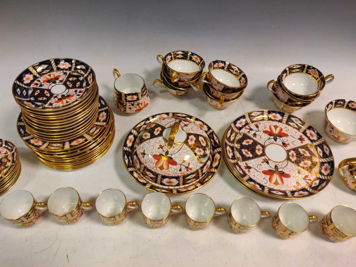 A Royal Crown Derby tea & coffee service, including twelve teacups, saucers, plates, four larger