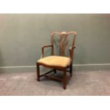 A George III mahogany elbow chair, with a pierced vase shape splat and moulded down scrolling arms