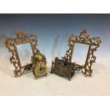 A pair of late 19th/ early 20th century Florentine style gilt metal picture frames with pierced