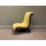 An Aesthetic period ebonised slipper chair with gilt details, the scrolled back and seat raised on