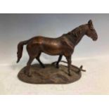 After Paul Edouard de la Brierre - a 20th Century cast bronze figure of a horse standing beside a