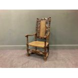 A carved walnut armchair, late 17th century,the rectangular caned back with S-scoll decoration