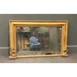 A Victorian gilt overmantel mirror, the rectangular plate within a moulded frame decorated with