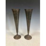 A pair of Indian export bronze vases, of trumpet form with incised floral decoration, possibly