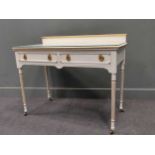 A 19th century white painted dressing table, with raised back gallery over two frieze drawers raised