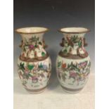 A pair of late 19th century Japanese vases decorated with festival scenes, 33cm highVase 1 - small