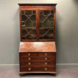 A George III mahogany bureau bookcase,