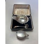 A cased silver sauce boat and ladle, together with a silver mustard, 8.5ozt gross