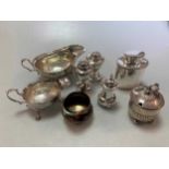 A pair of silver pepperettes and a single pepperette, a silver mustard, a silver cream jug and 2