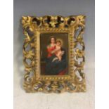 A late 19th/ early 20th century Florentine painted ceramic tile depicting Madonna and child 12 x