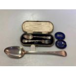 A late Georgian silver basting spoon by Eley and Fearn, a silver Christening fork and spoon,