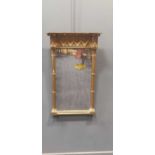 A Regency gilt pier mirror, the rectangular mirrored plate flanked by cluster columns below a