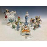 Staffordshire figures, to include a man on horse back with stringed instrument, another of a girl