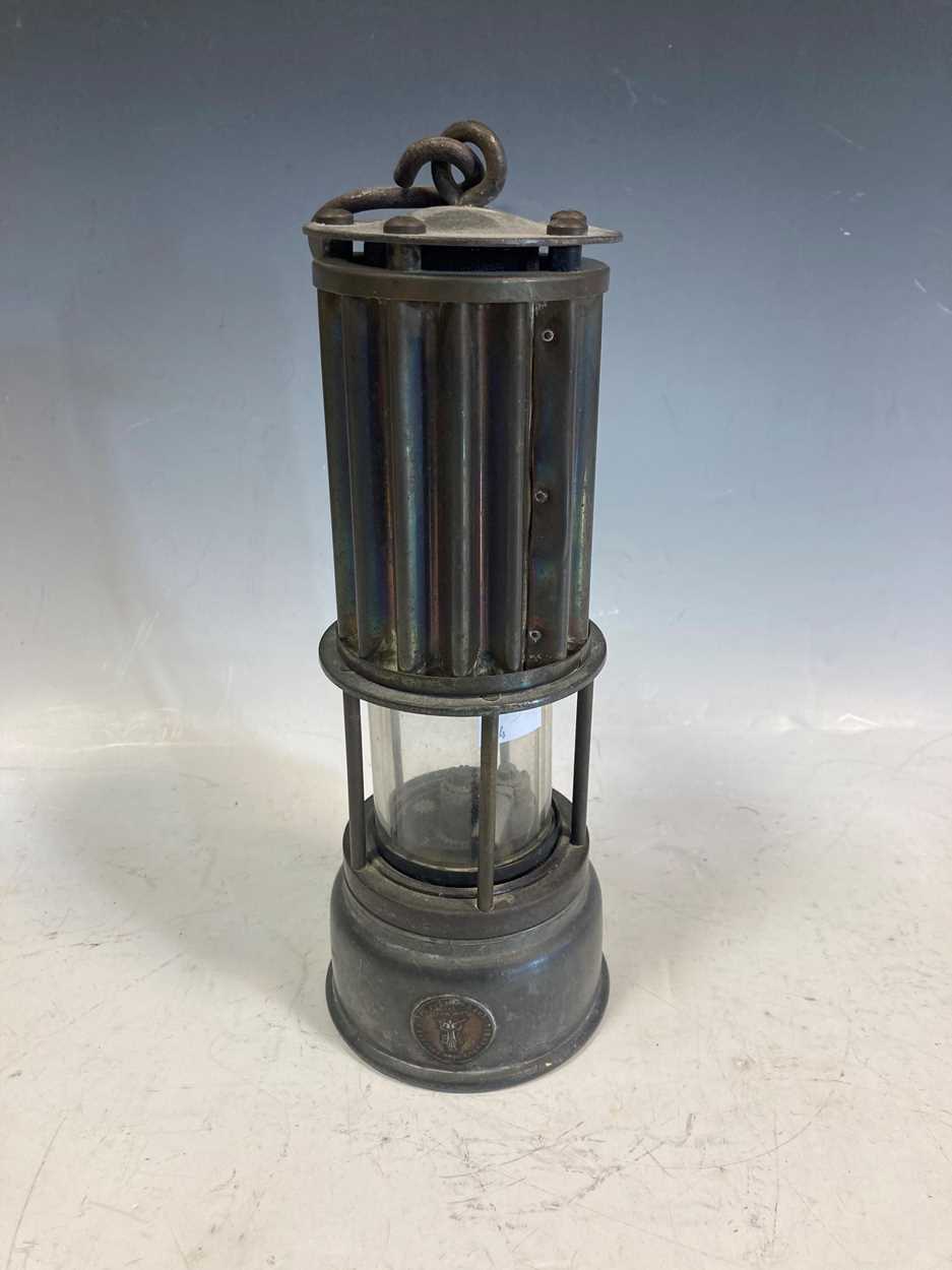 A Miner's lamp by The Premier Lamp Co, Leeds, with corrugated effect upper body, 27cm high