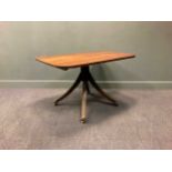 A Regency mahogany tilt-top breakfast table, the rounded rectangular top over a ring turned