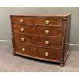 A 19th century Scottish mahogany bow front chest of two short over three long drawers flanked by