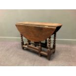 A late 17th century oak gateleg tablethe oval drop flap top raised on bobbin turned supports68 x