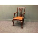 An Irish George III style mahogany armchair, 19th century, with pierced vase shaped splat between