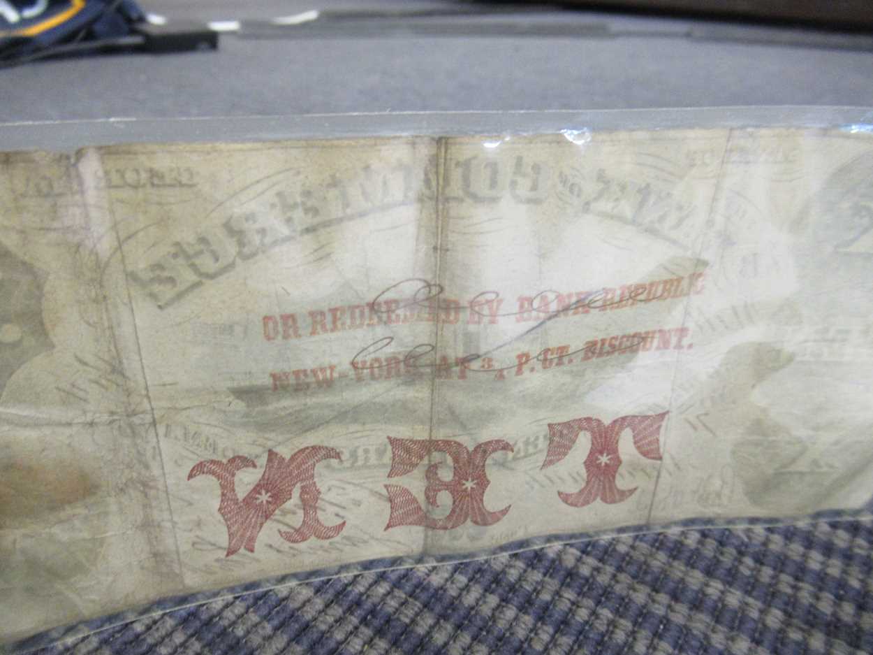 Four bank notes to include: The Confederate States of America ten dollar note hand numbered 925/ - Image 7 of 8